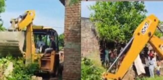 श्रावस्ती में मुख्य मार्ग पर बनी दीवार जेसीबी से हटाई:मजरे में शिकायत पर प्रशासन ने कराई जमीन की नापजोख, रास्ता खुला